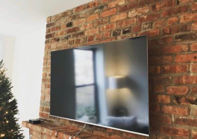 Tv Mounted Into Brick Wall